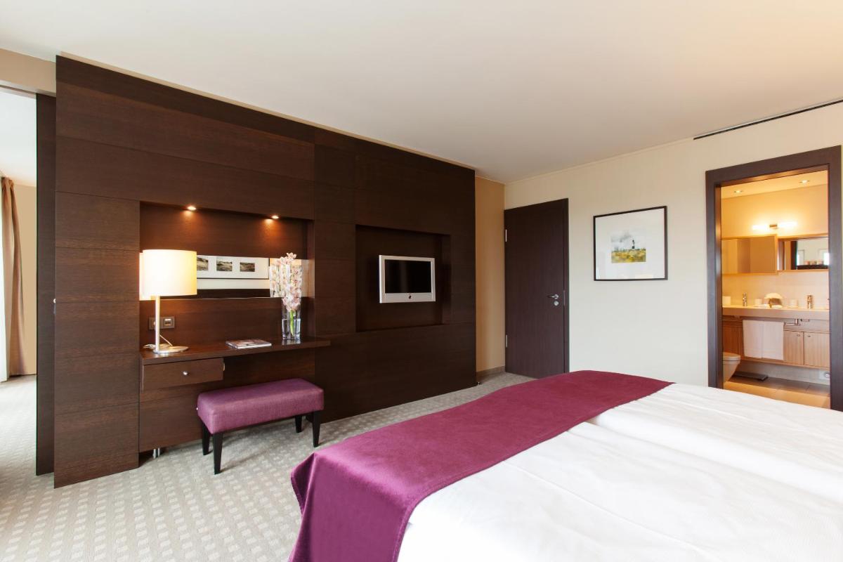 Ein Bett oder Betten in einem Zimmer der Unterkunft A-ROSA Sylt