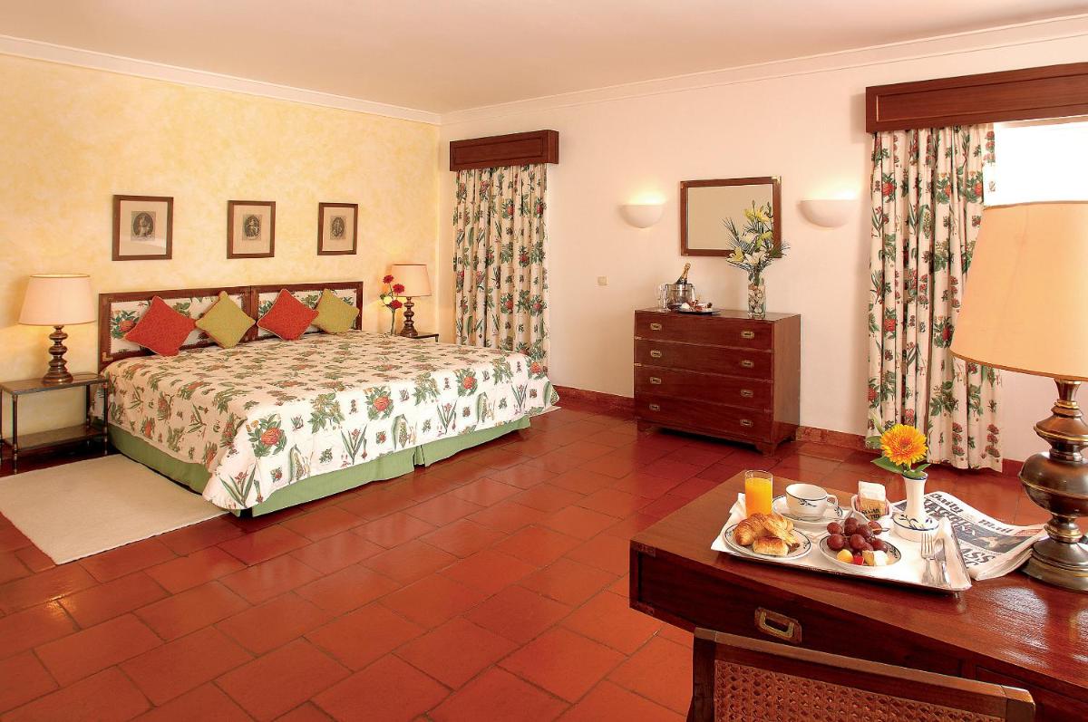 Uma cama ou camas num quarto em Dona Filipa Hotel