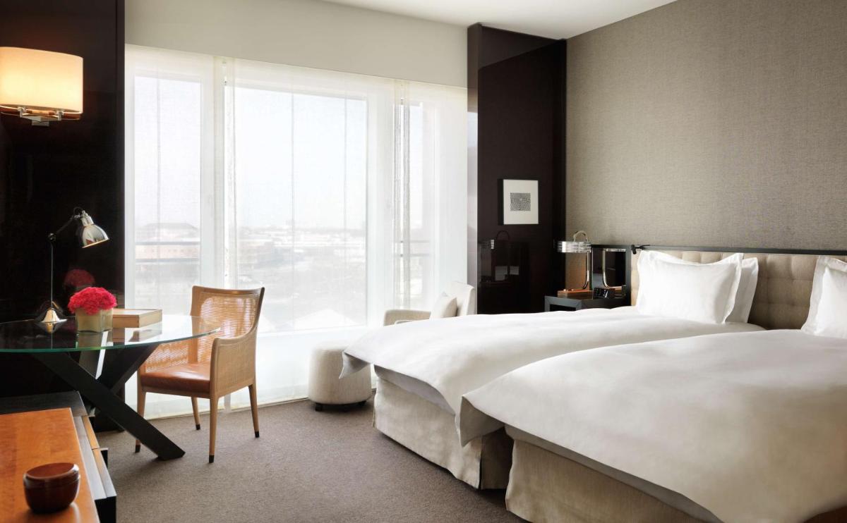 Ein Bett oder Betten in einem Zimmer der Unterkunft Grand Hyatt Berlin