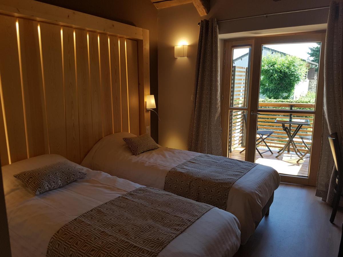 Un ou plusieurs lits dans un hébergement de l'établissement Logis SPA Hotel Restaurant De La Poste