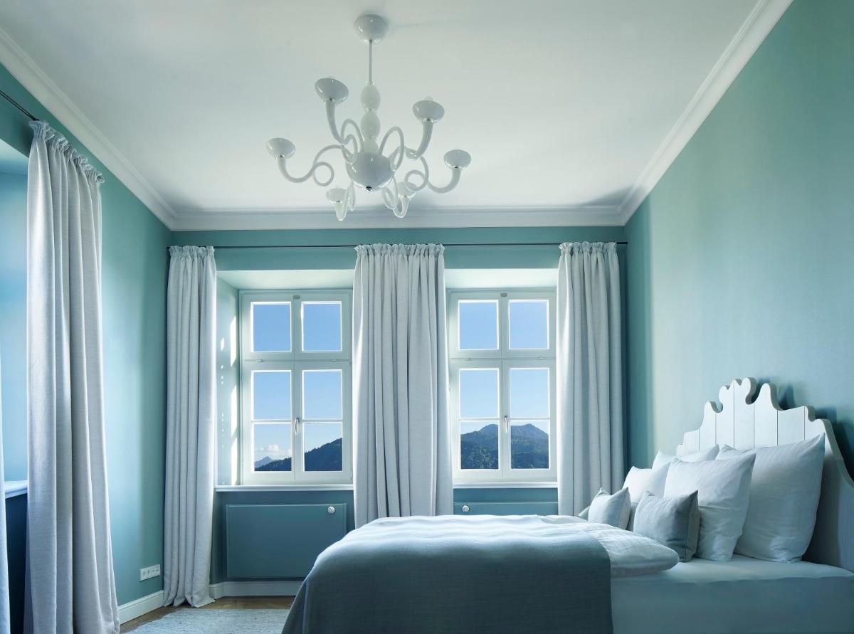 Ein Bett oder Betten in einem Zimmer der Unterkunft Das Tegernsee