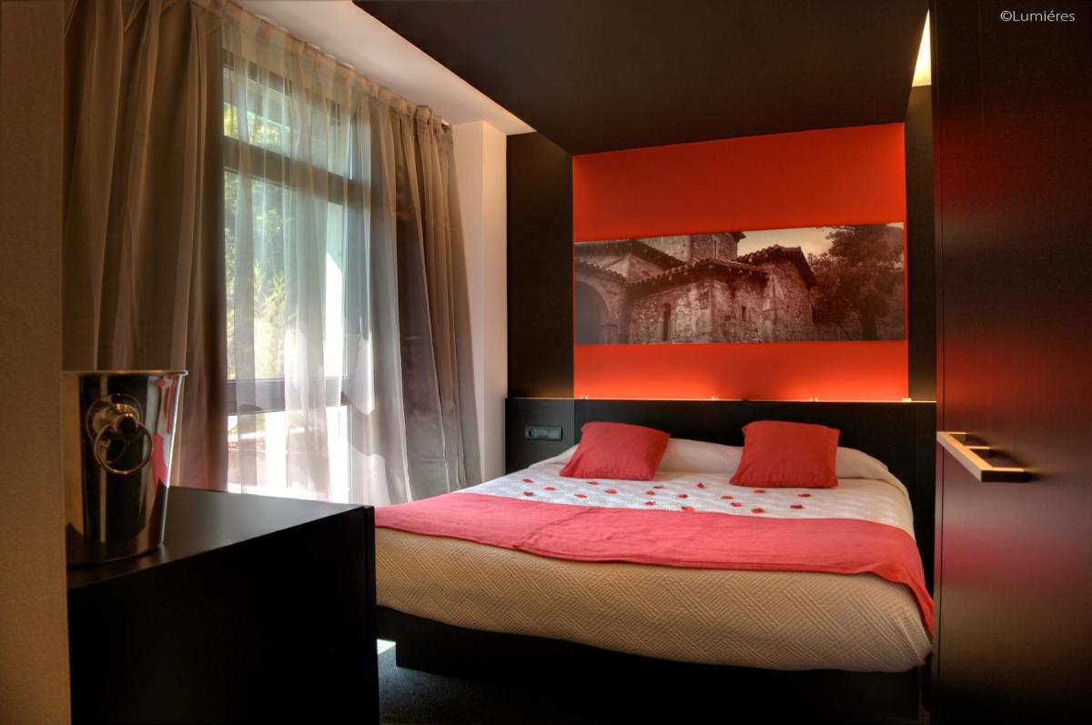 Cama o camas de una habitación en Hotel Playa Ribera