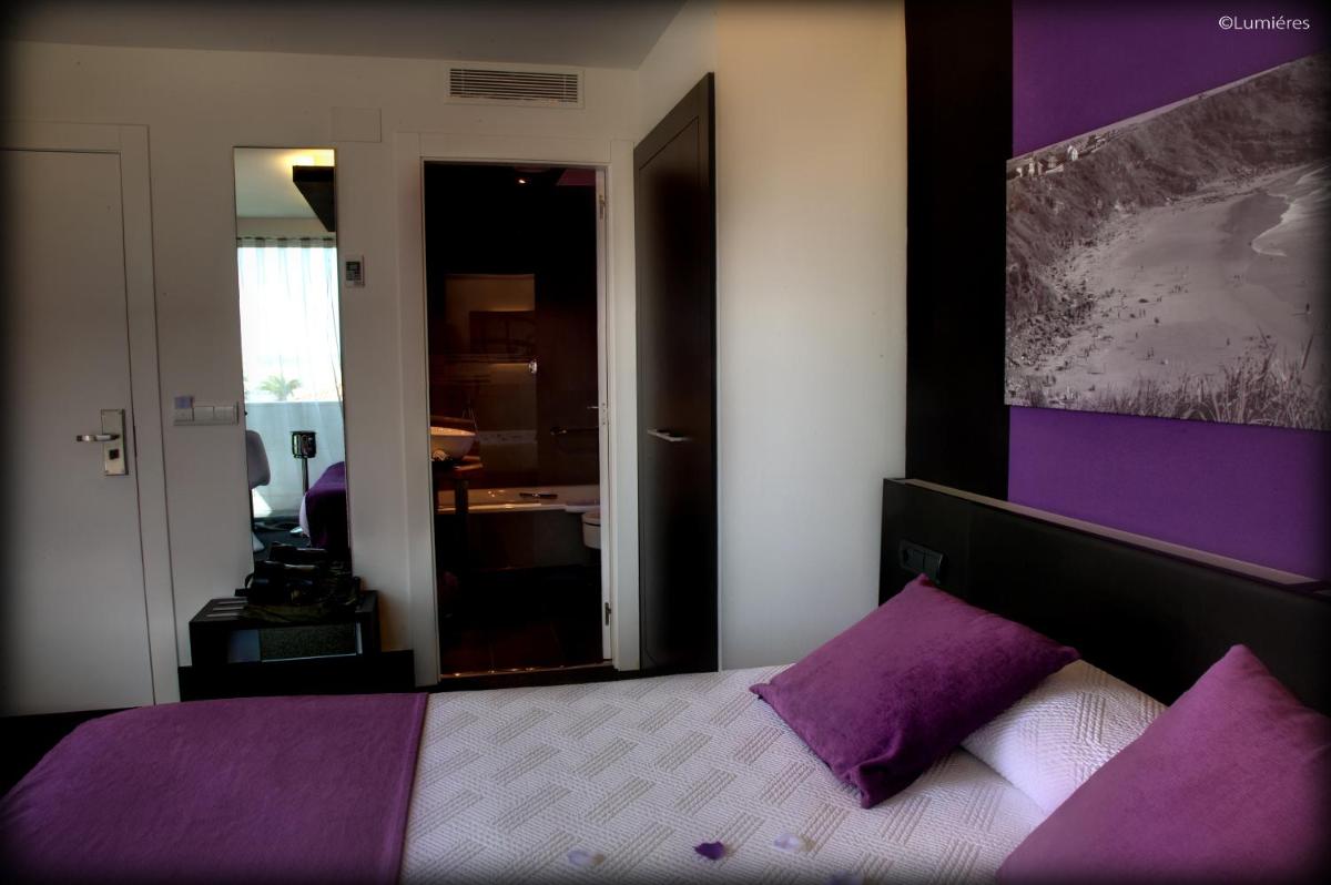 Cama o camas de una habitación en Hotel Playa Ribera