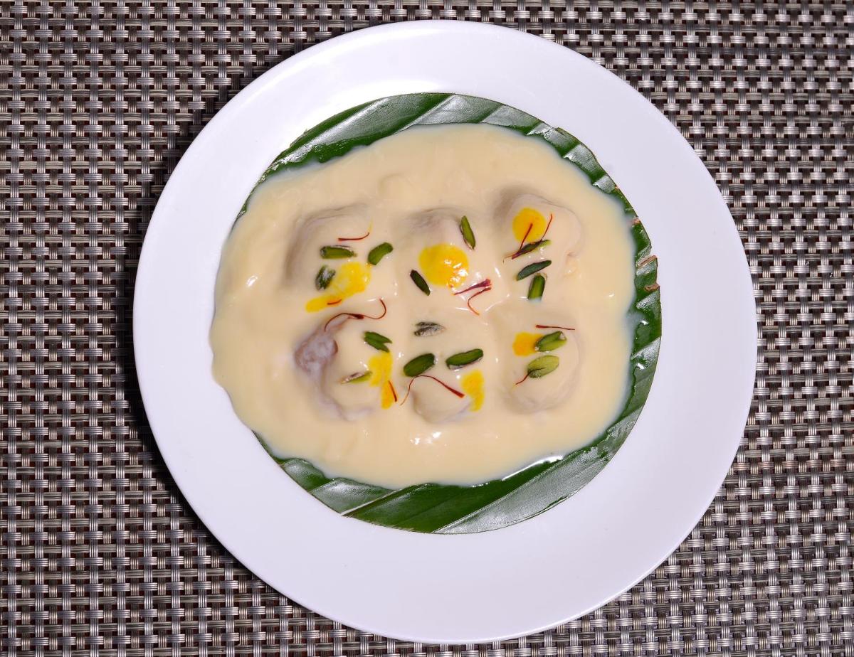 a plate with a deviled egg dish on a table at Pride Plaza Hotel, Kolkata in Kolkata