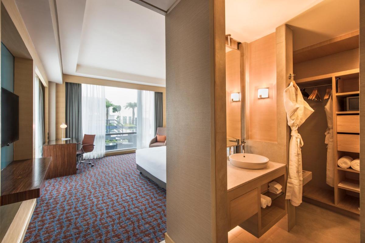 a hotel room with a bed and a sink at Hyatt Regency Lucknow Gomti Nagar in Lucknow