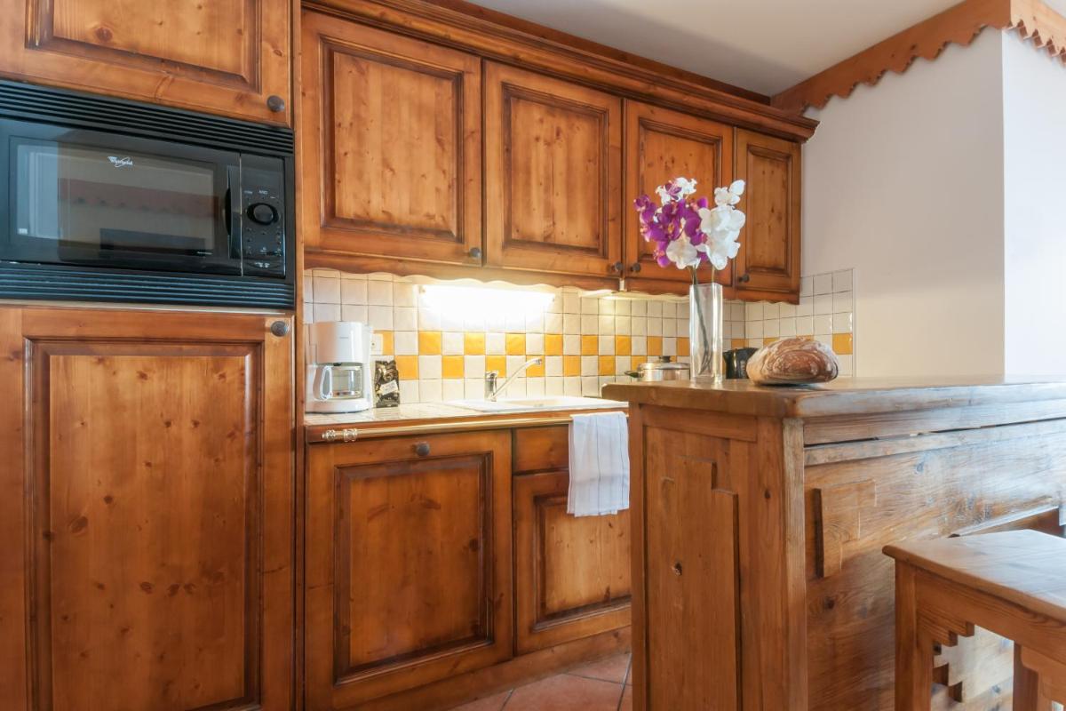 Cuisine ou kitchenette dans l'établissement Résidence Pierre & Vacances Premium Les Hauts Bois