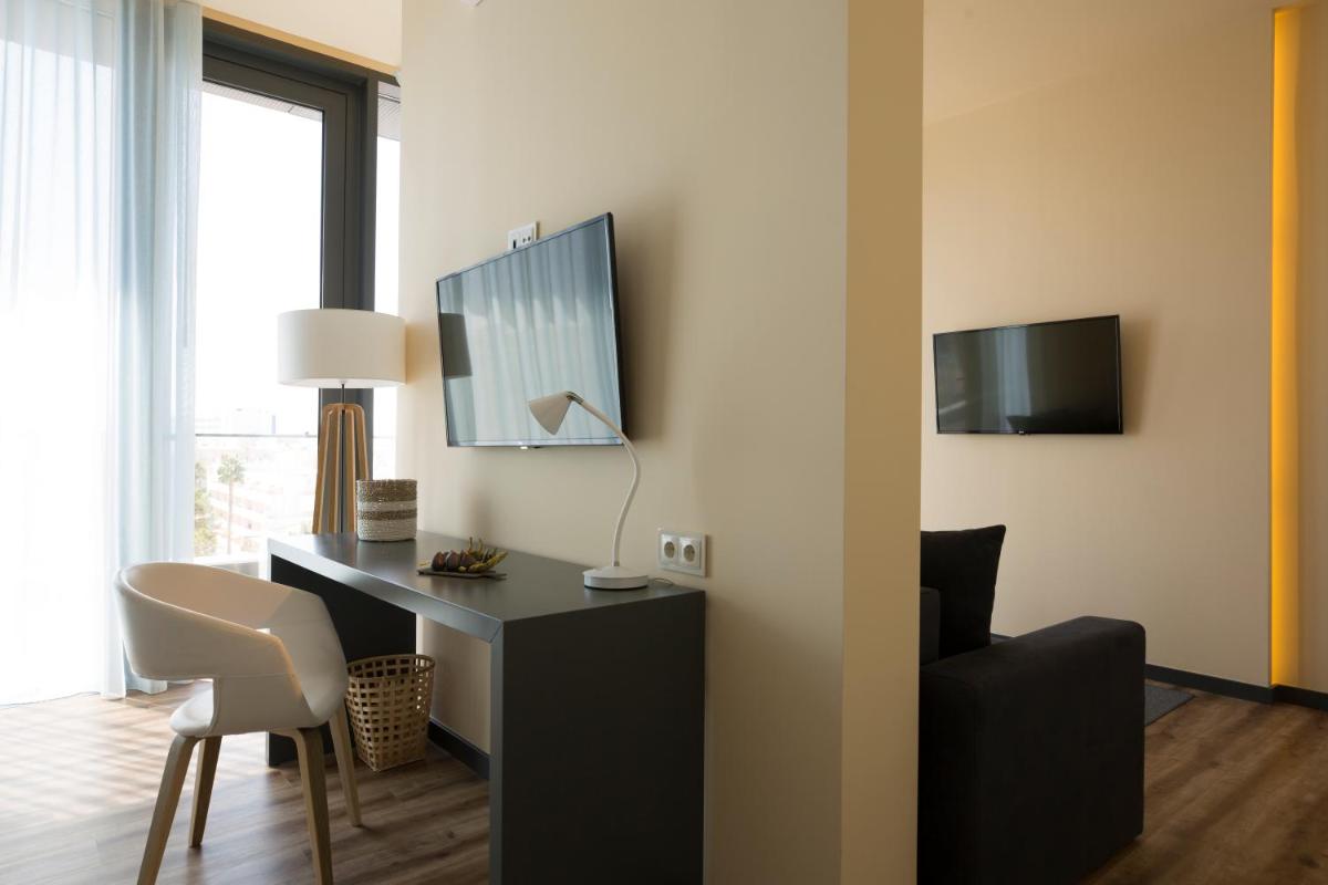 Uma televisão e/ou sistema de entretenimento em The Prime Energize Hotel & SPA - Algarve