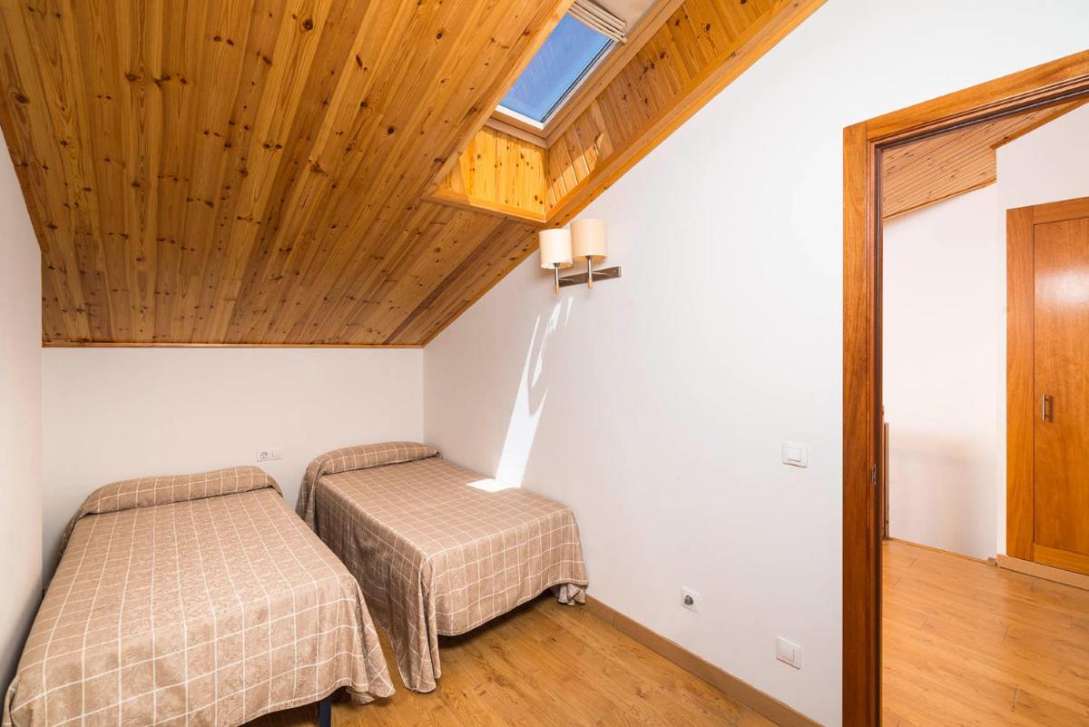 Cama o camas de una habitación en Guitart La Molina Aparthotel & Spa