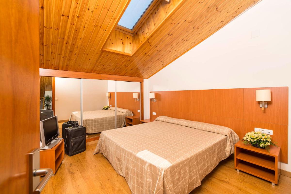 Cama o camas de una habitación en Guitart La Molina Aparthotel & Spa