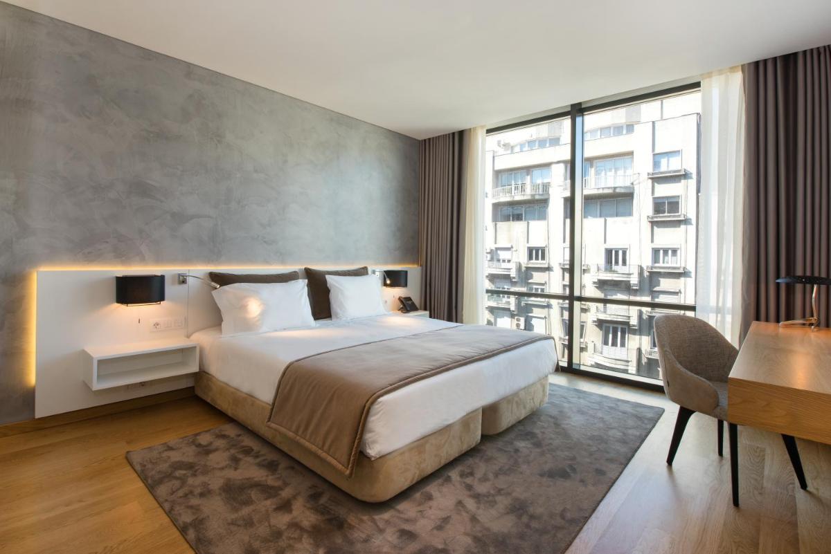 Uma cama ou camas num quarto em Iberostar Selection Lisboa