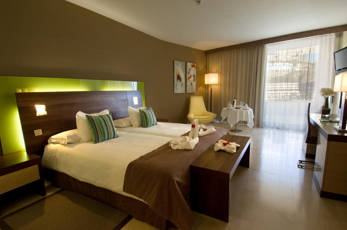 Cama o camas de una habitación en Hotel LIVVO Valle Taurito & Aquapark