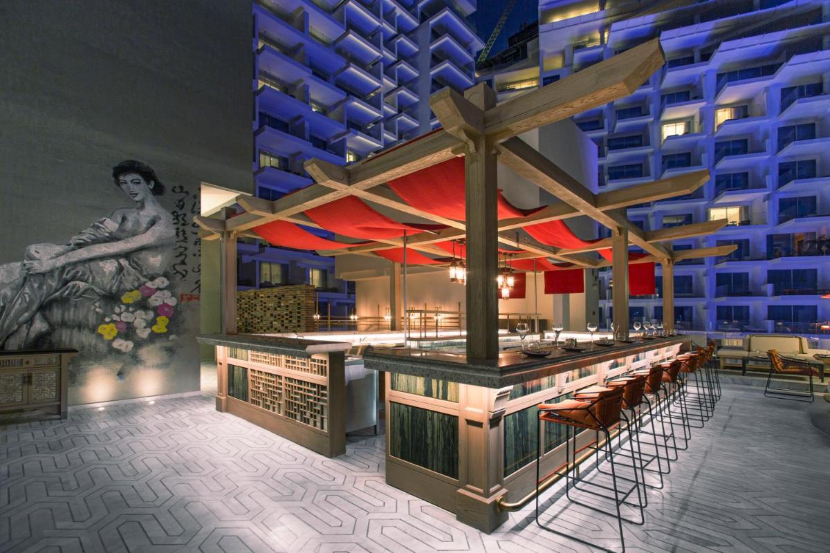 a rendering of a restaurant with a bar in front of a building at FIVE Palm Jumeirah Dubai in Dubai