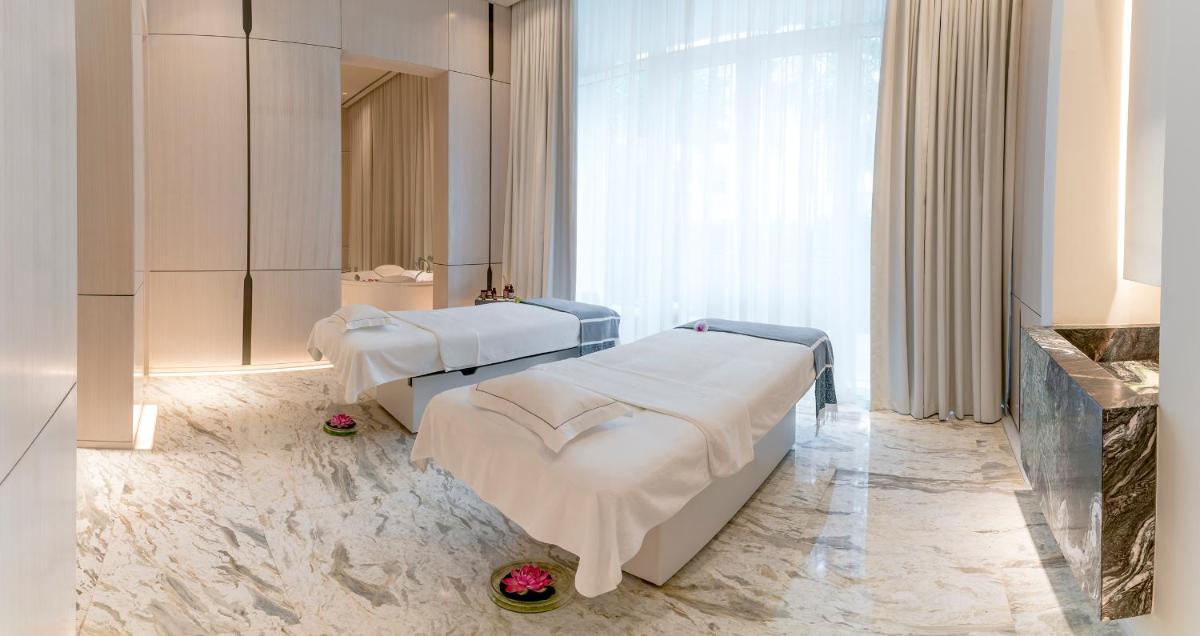 a hospital room with two beds and a mirror at FIVE Palm Jumeirah Dubai in Dubai
