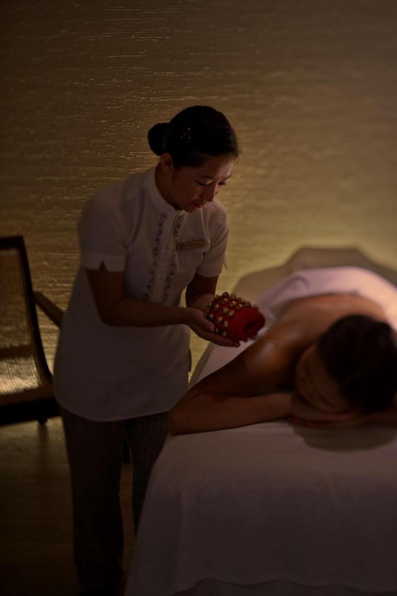 a woman laying on a bed next to a nurse at Park Hyatt Chennai in Chennai