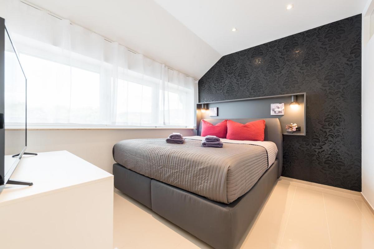 Ein Bett oder Betten in einem Zimmer der Unterkunft Friedrich Boutique-Apartments