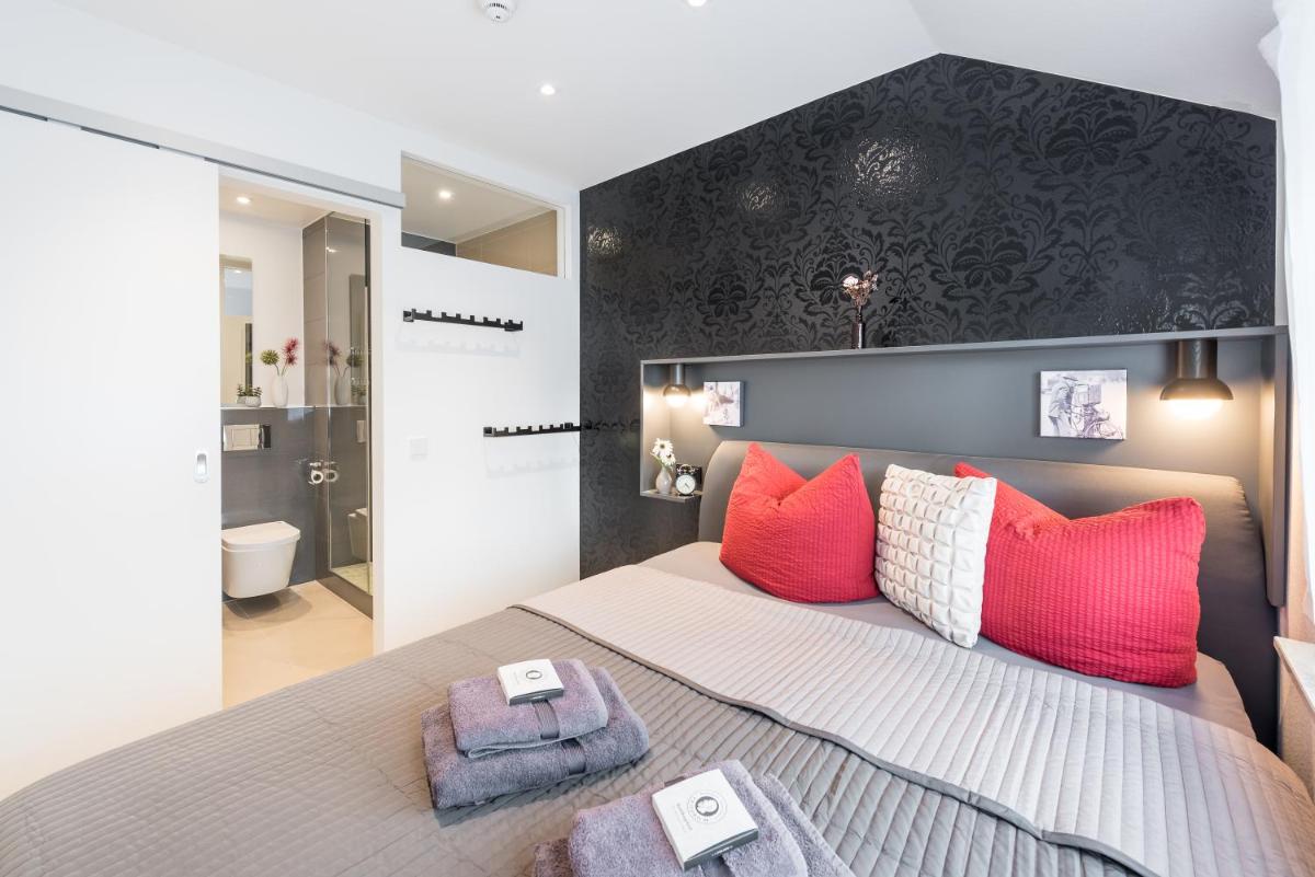 Ein Bett oder Betten in einem Zimmer der Unterkunft Friedrich Boutique-Apartments