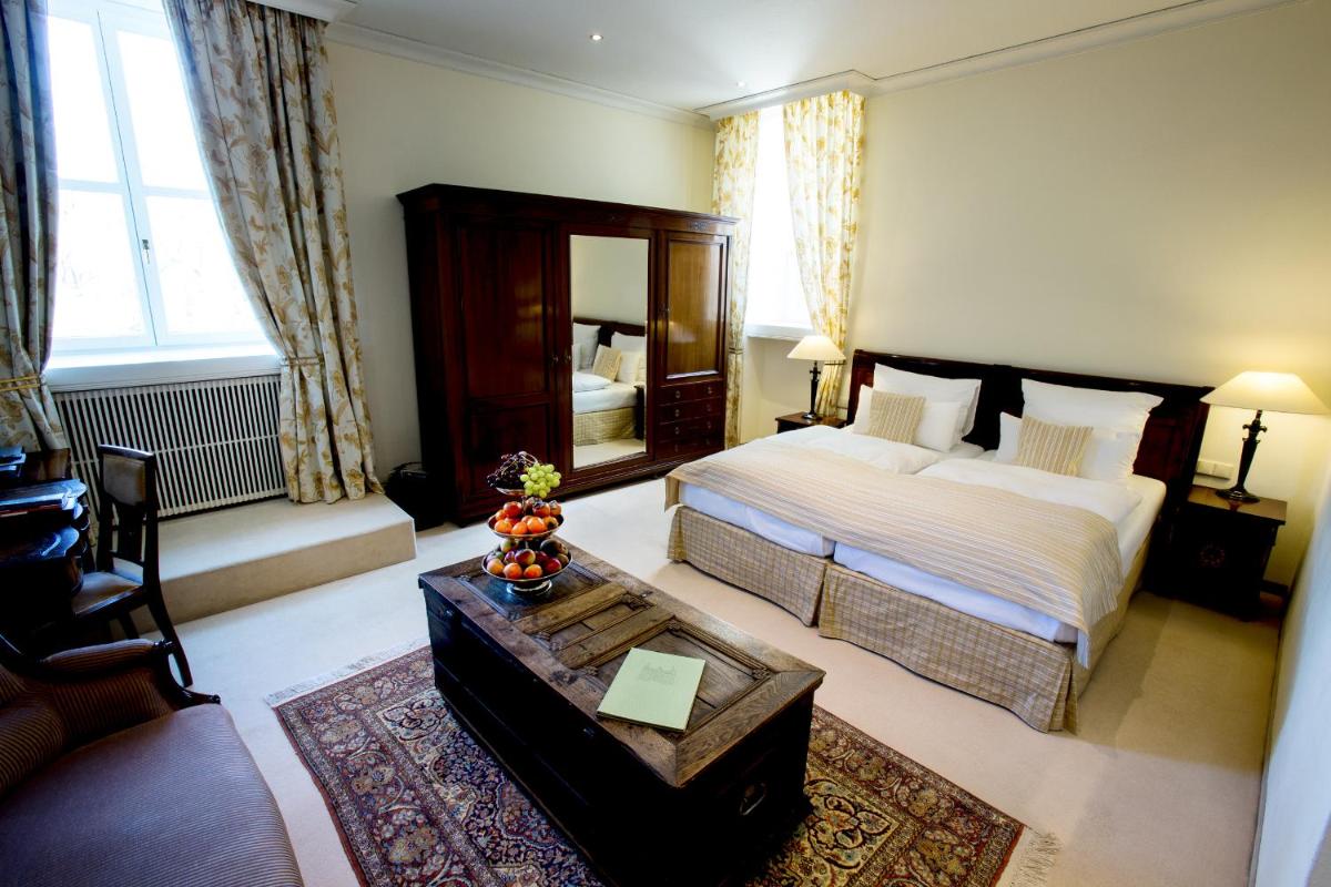Ein Bett oder Betten in einem Zimmer der Unterkunft Schlosshotel Hugenpoet