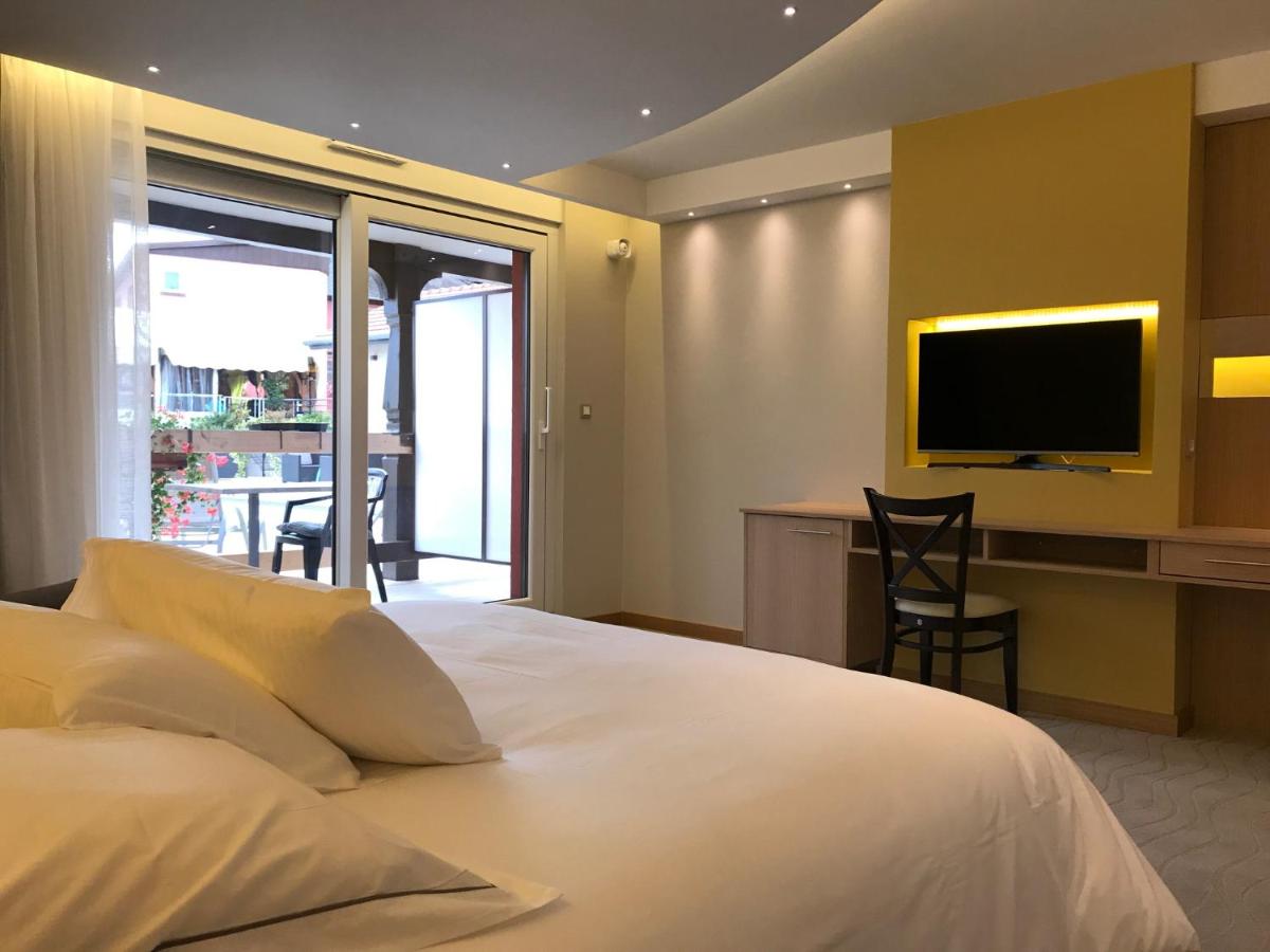 Un ou plusieurs lits dans un hébergement de l'établissement Au Soleil, Hôtel Restaurant & Spa