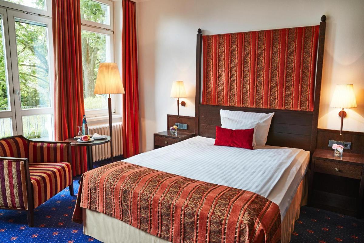 Ein Bett oder Betten in einem Zimmer der Unterkunft Steigenberger Inselhotel