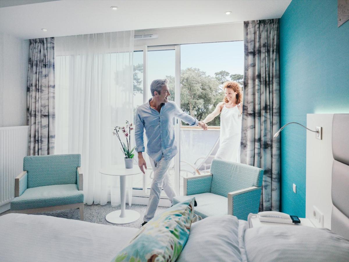 Un ou plusieurs lits dans un hébergement de l'établissement Alliance Pornic Hôtel Thalasso & Spa