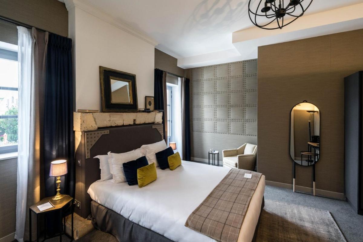 Un ou plusieurs lits dans un hébergement de l'établissement Le Général d'Elbée Hotel & Spa - Teritoria