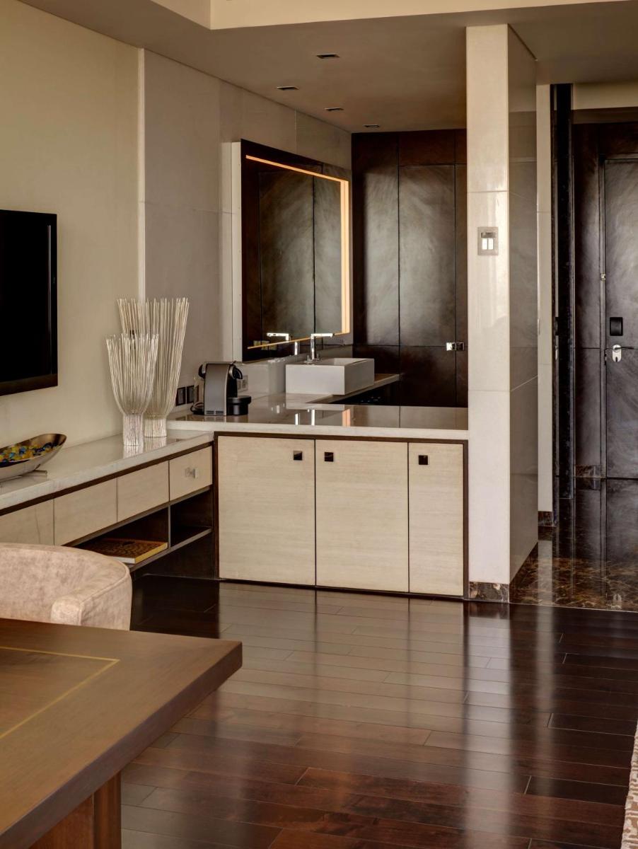 a large kitchen with white cabinets and a sink at Park Hyatt Hotel and Residences, Hyderabad in Hyderabad