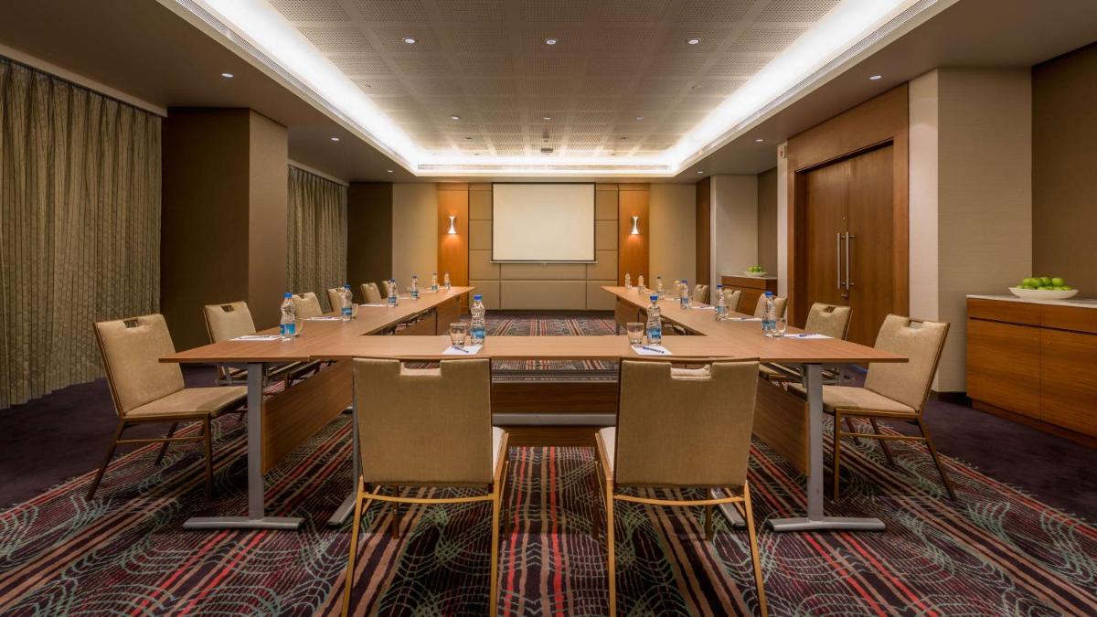 a large conference room with a long table and chairs at Hyatt Place Pune Hinjawadi in Pune