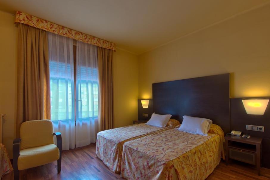 Cama o camas de una habitación en Hotel Restaurant Pessets & SPA