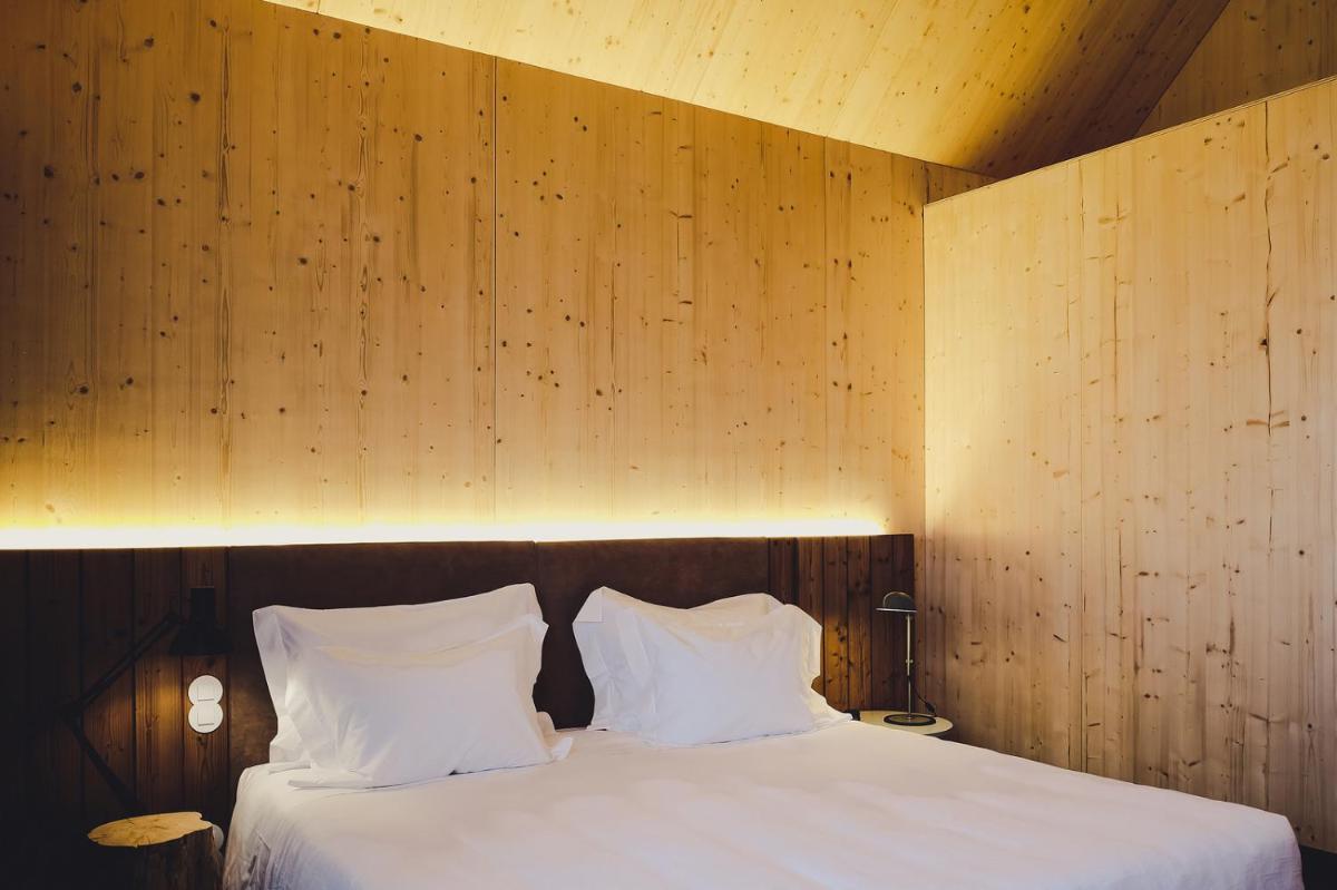 Uma cama ou camas num quarto em FeelViana Sport Hotel