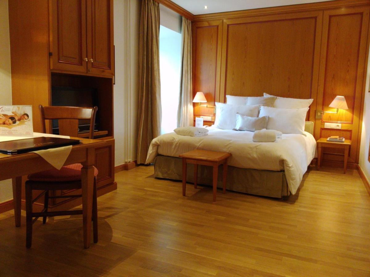 Un ou plusieurs lits dans un hébergement de l'établissement Hotel & Spa A la cour d'Alsace by HappyCulture