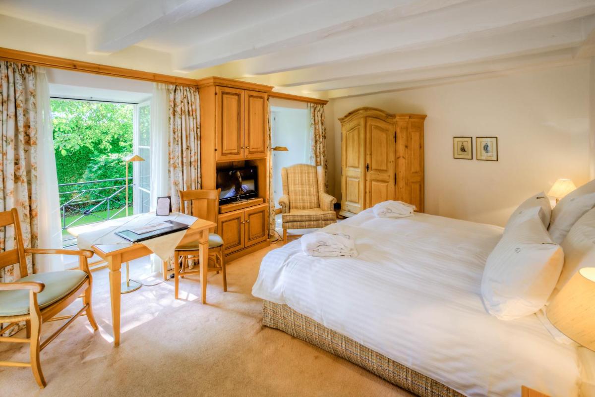 Un ou plusieurs lits dans un hébergement de l'établissement Hotel & Spa A la cour d'Alsace by HappyCulture