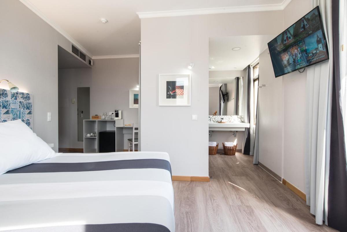 Uma cama ou camas num quarto em Sé Boutique Hotel