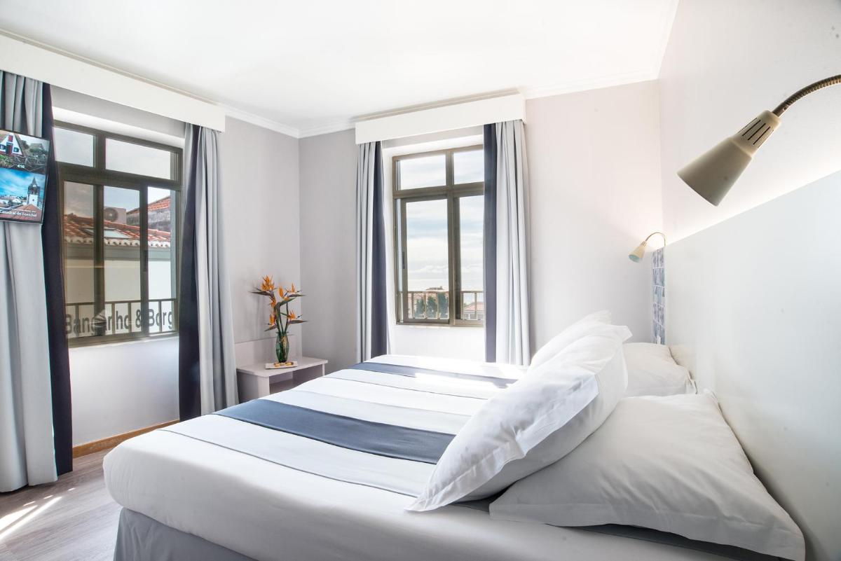 Uma cama ou camas num quarto em Sé Boutique Hotel