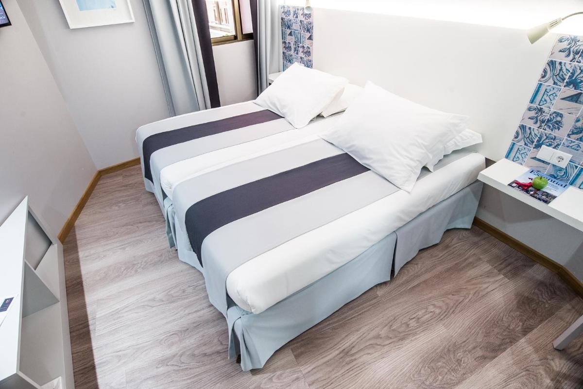 Uma cama ou camas num quarto em Sé Boutique Hotel