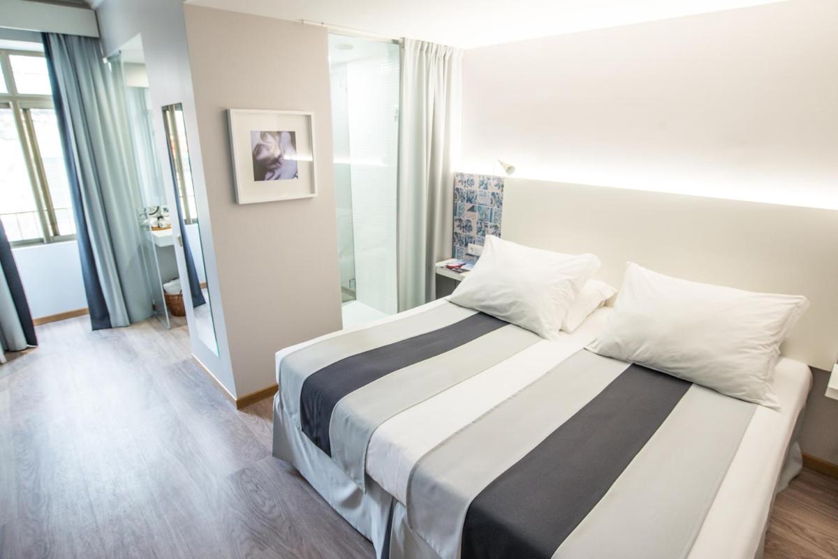 Uma cama ou camas num quarto em Sé Boutique Hotel