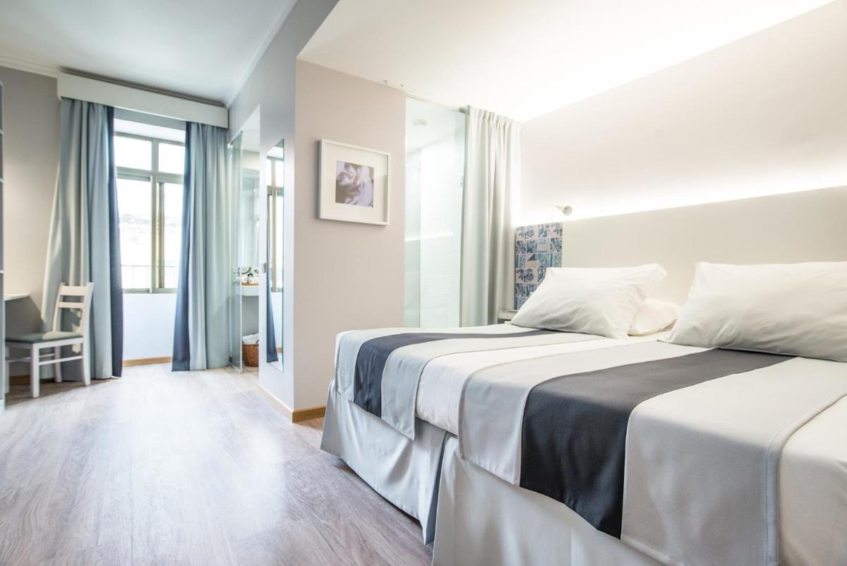 Uma cama ou camas num quarto em Sé Boutique Hotel