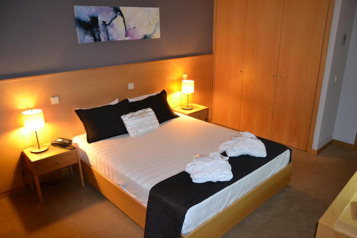 Uma cama ou camas num quarto em Hotel Bienestar Termas de Moncao