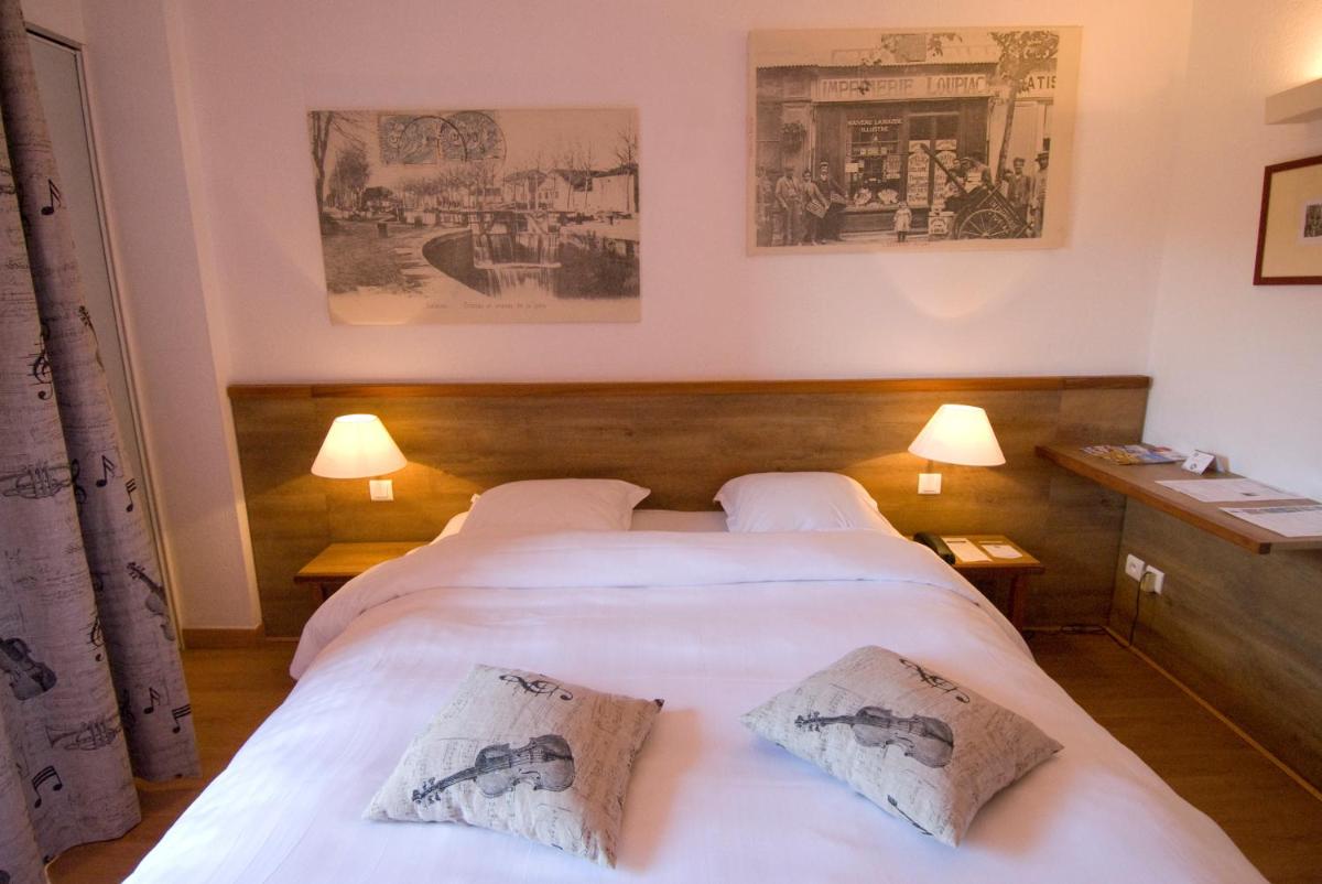 Un ou plusieurs lits dans un hébergement de l'établissement Hotel Le Phoebus Garden & Spa