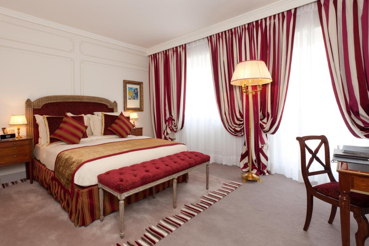 Un ou plusieurs lits dans un hébergement de l'établissement Majestic Apartments Champs Elysées