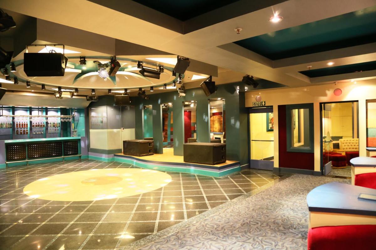 a large room with a dance floor and a stage at Jaypee Palace Hotel in Agra