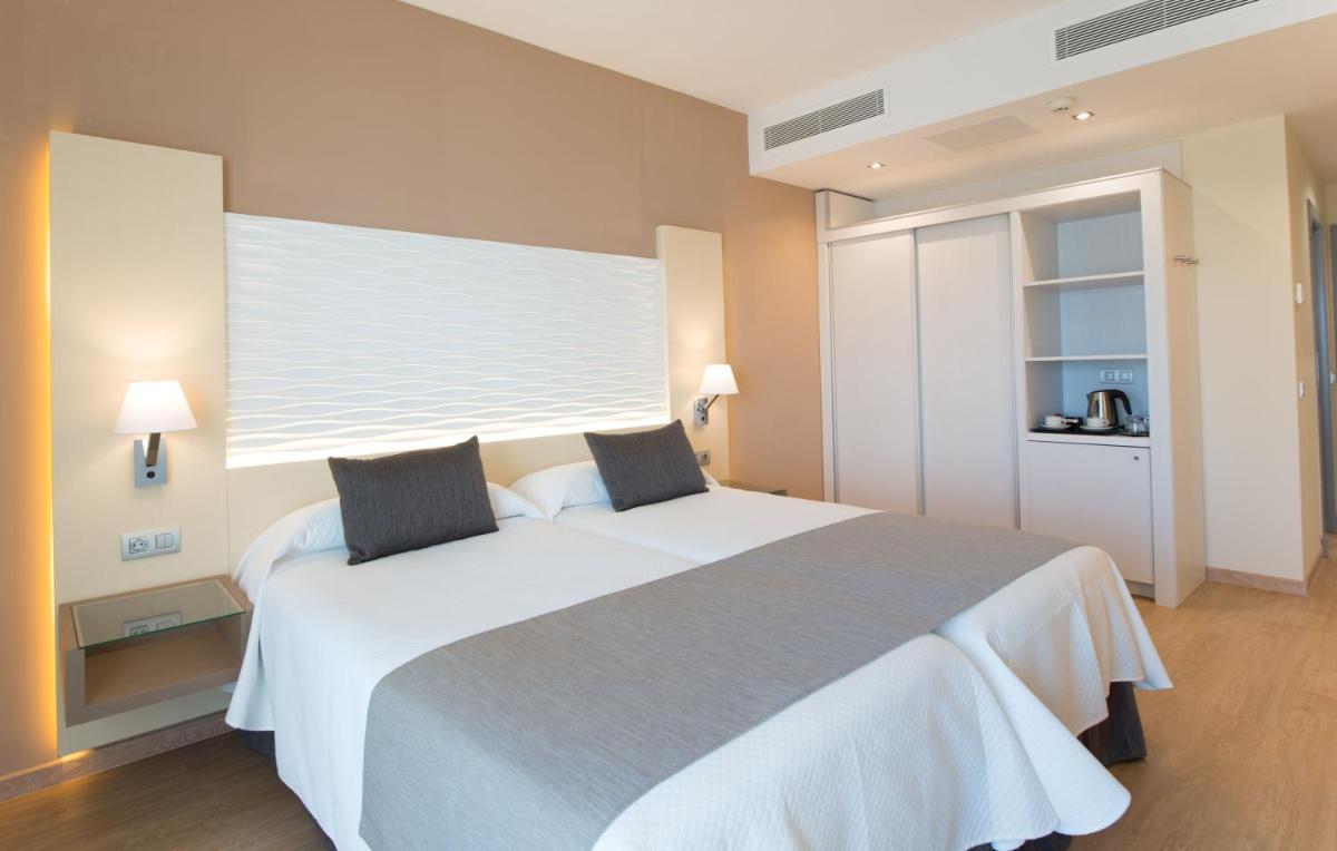 Cama o camas de una habitación en HL Suitehotel Playa del Inglés - Adults Only