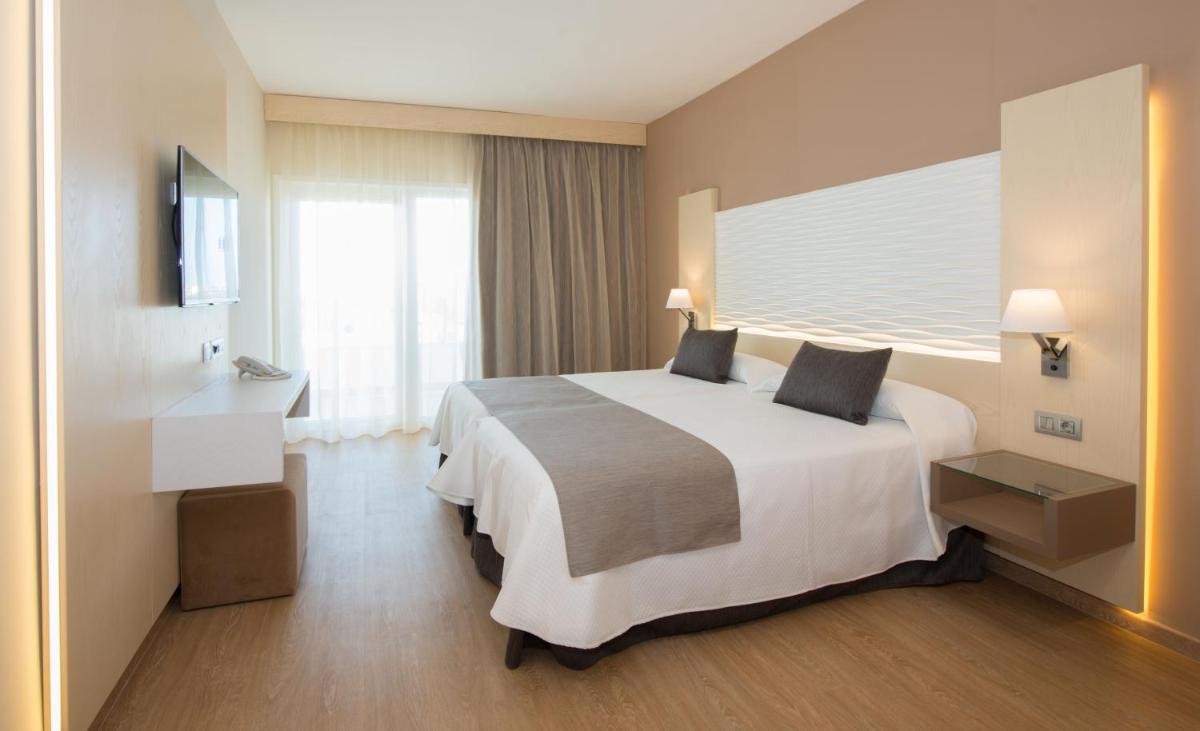 Cama o camas de una habitación en HL Suitehotel Playa del Inglés - Adults Only