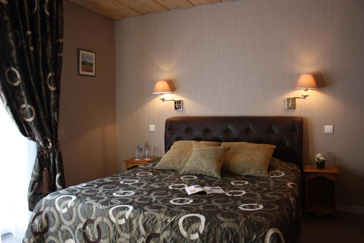 Un ou plusieurs lits dans un hébergement de l'établissement Hôtel Restaurant Taillard