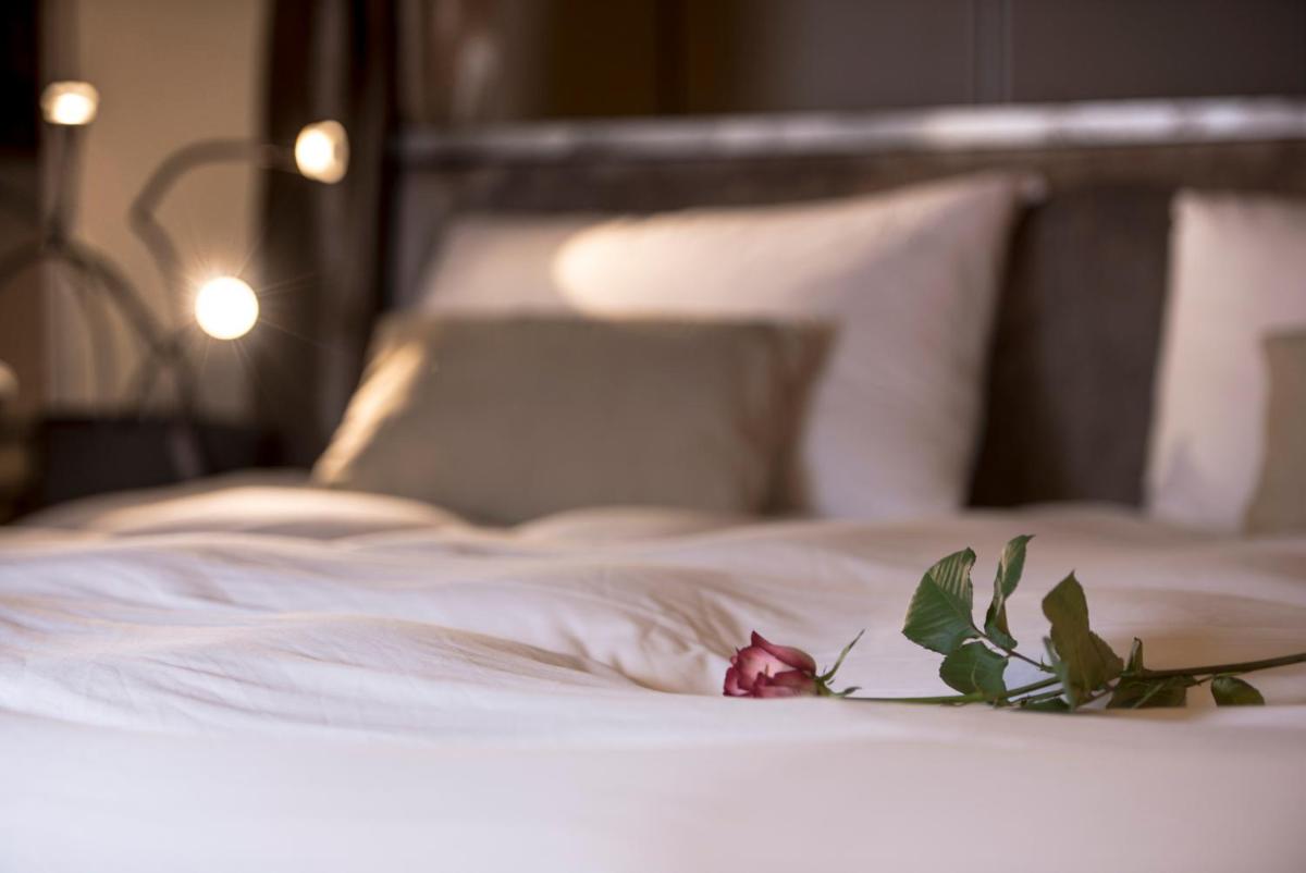 Un ou plusieurs lits dans un hébergement de l'établissement Hôtel Particulier Le 28 - Spa & Art Luxury Design by Alain Ducasse