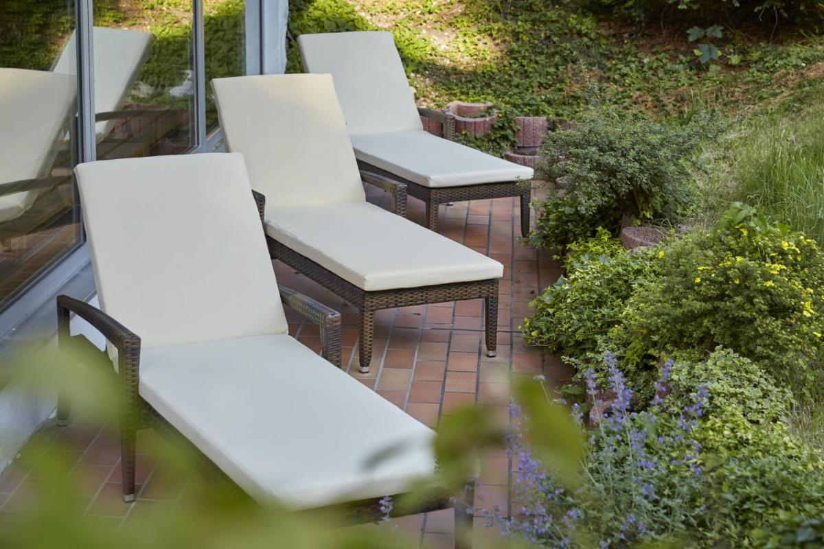 Ein Garten an der Unterkunft HYPERION Hotel Garmisch - Partenkirchen