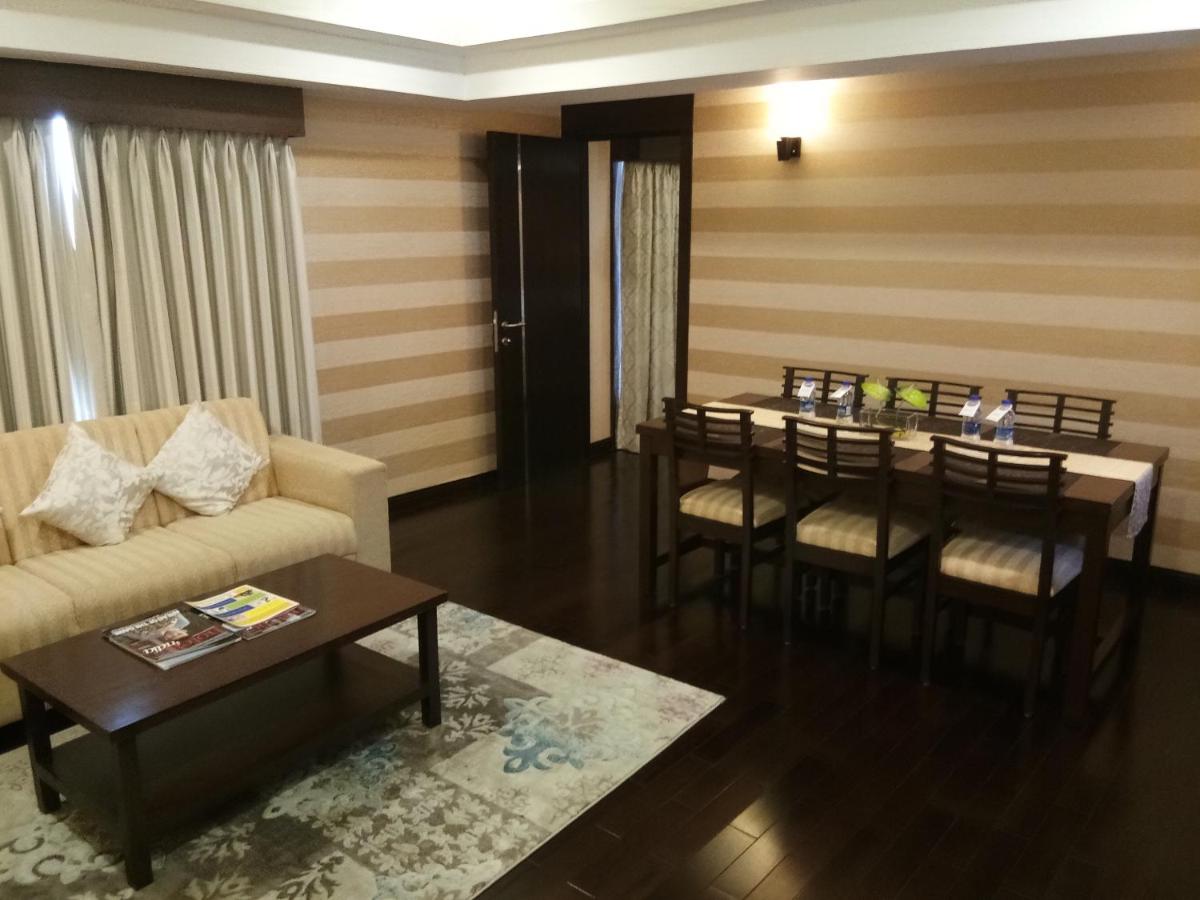 a living room with a couch and a table at Fortune Select Grand Ridge, Tirupati - Member ITC Hotels' Group in Tirupati
