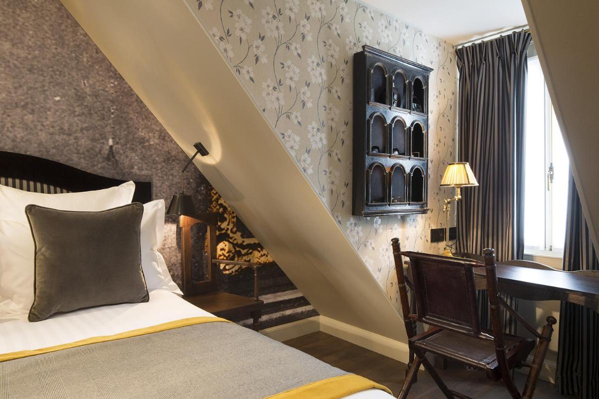Un ou plusieurs lits dans un hébergement de l'établissement Hôtel Da Vinci & Spa