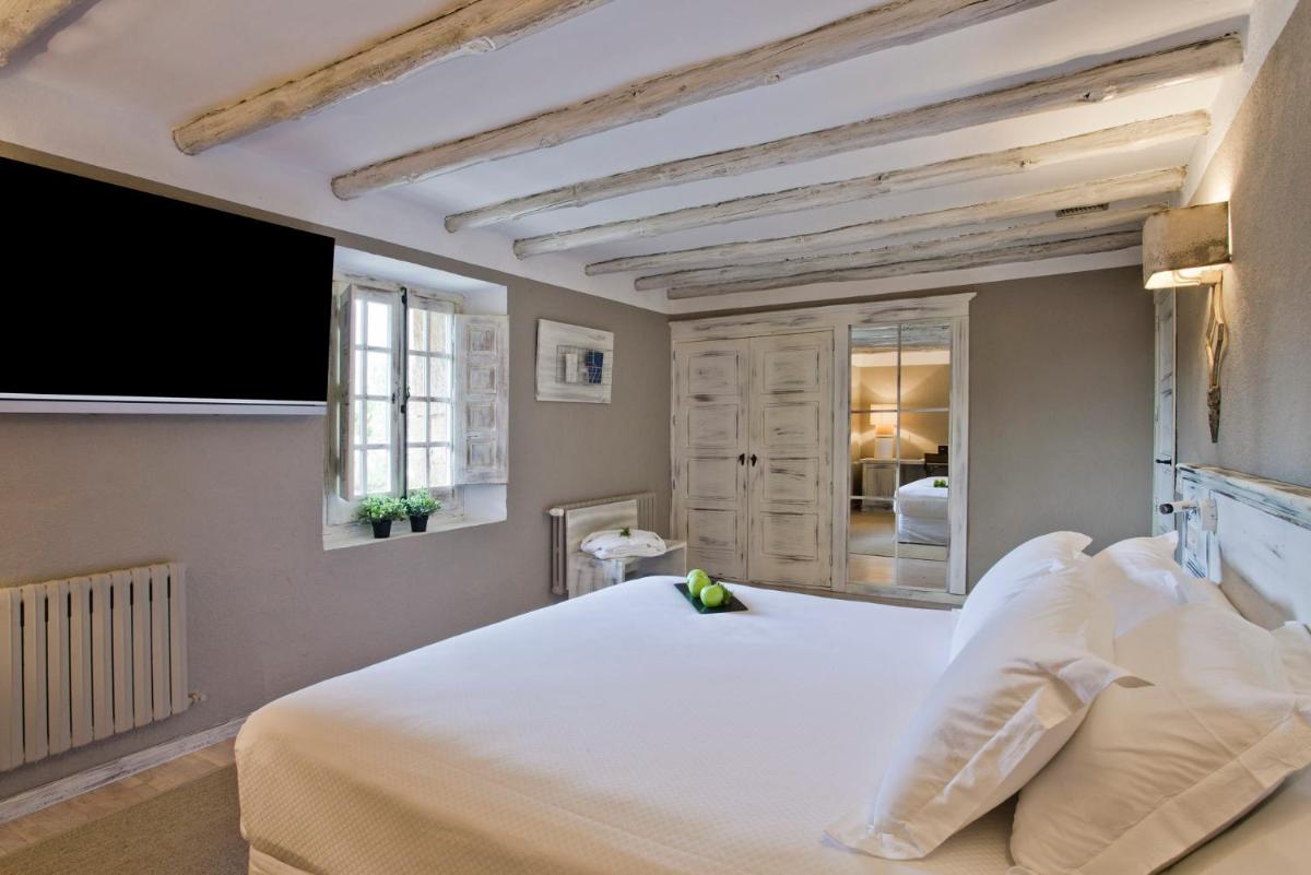 Cama o camas de una habitación en Hotel Luze El Toro