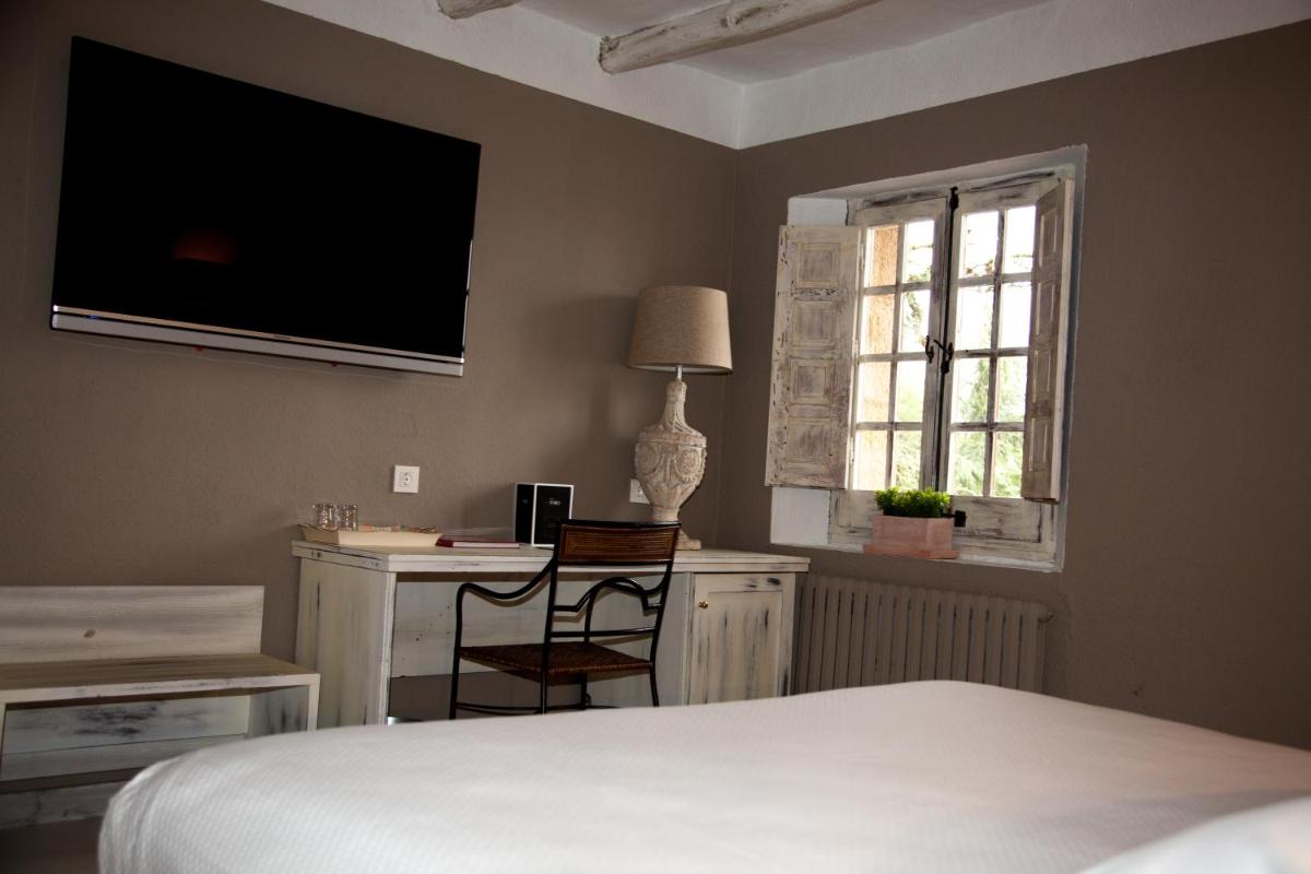 Cama o camas de una habitación en Hotel Luze El Toro