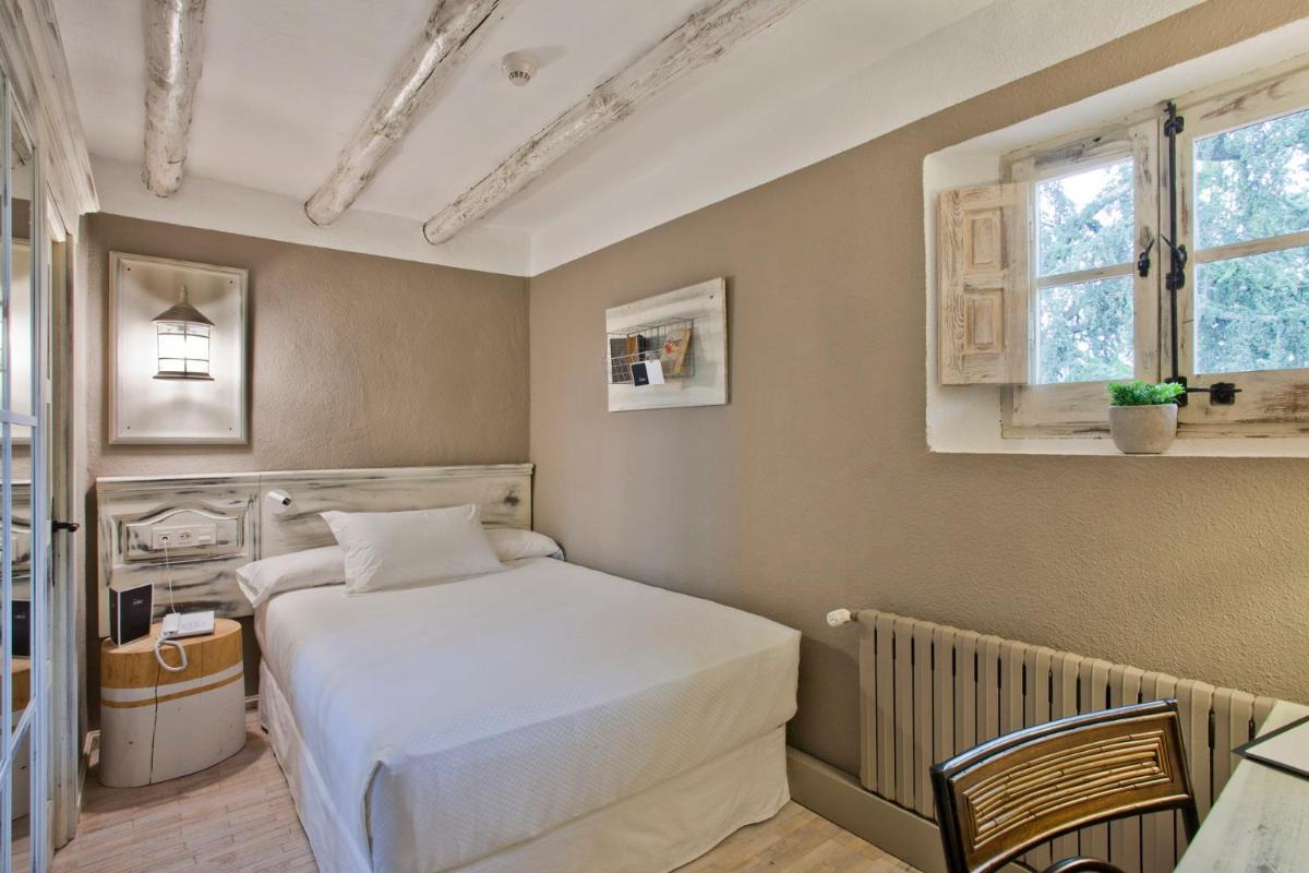 Cama o camas de una habitación en Hotel Luze El Toro